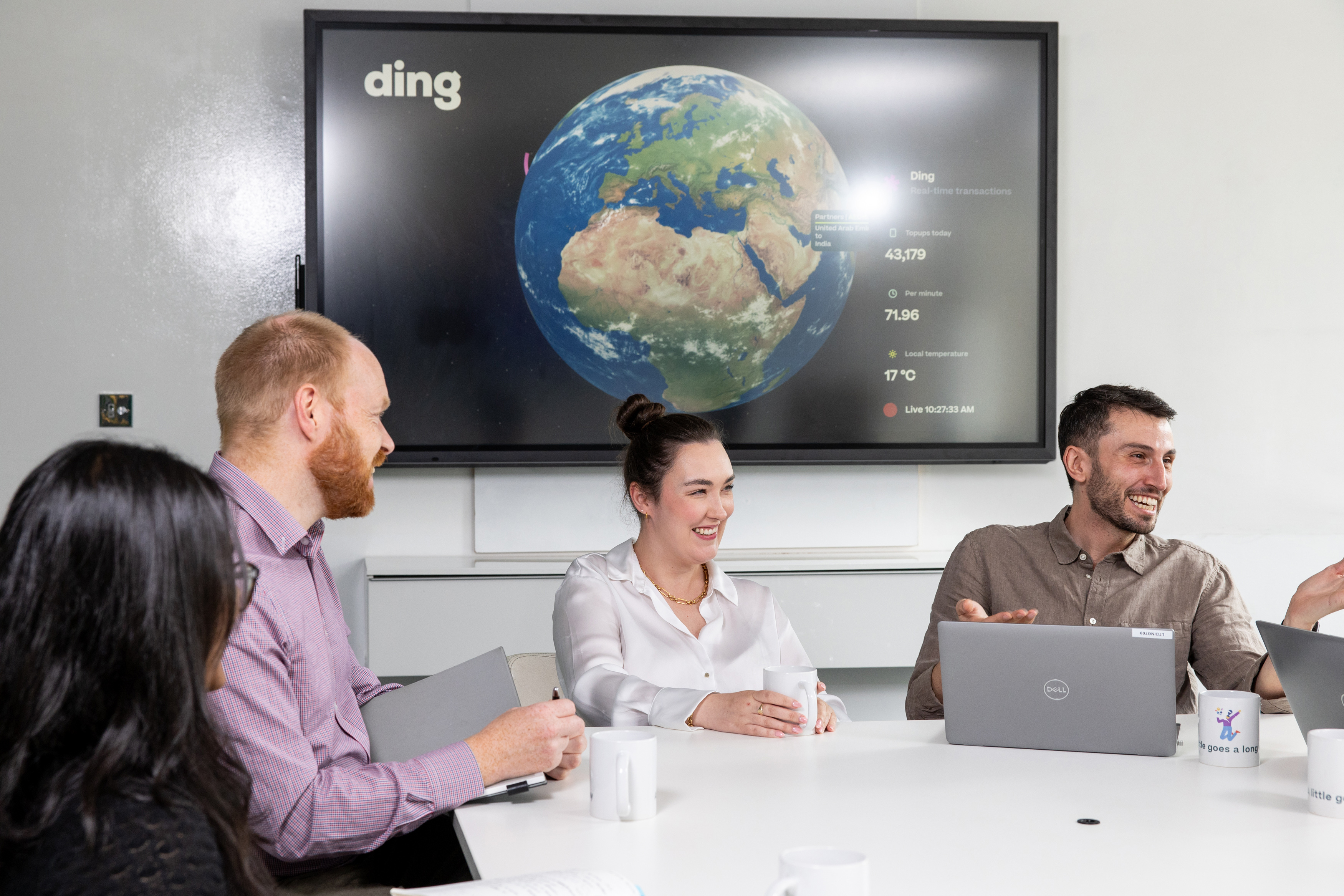 Global mission team meeting with world map